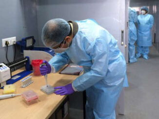 Healthcare workers in lab